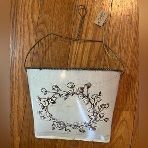 Rustic metal wall bucket with cotton wreath motif